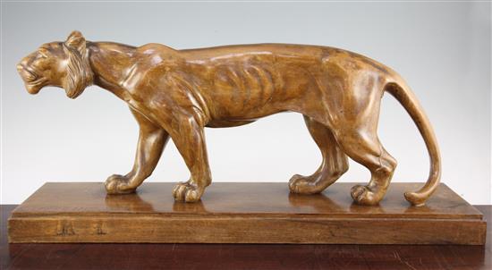 A French Art Deco carved wood model of a standing lioness, 26in.